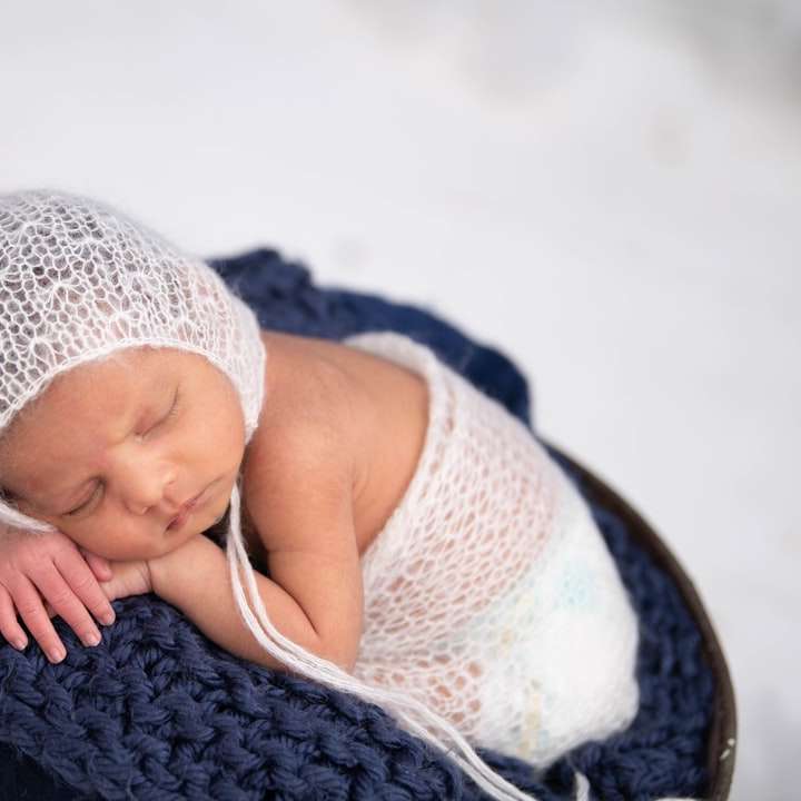 baby in white knit cap and knit cap online puzzle