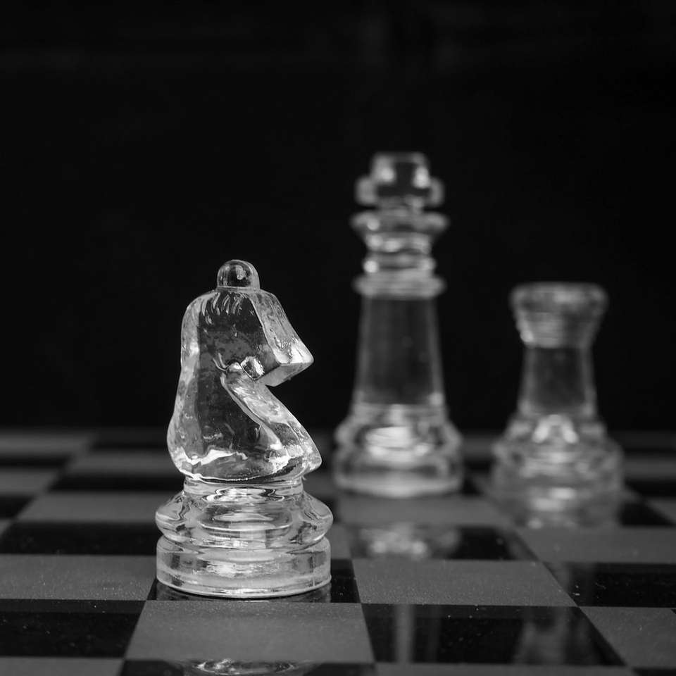 grayscale photo of chess pieces sliding puzzle online