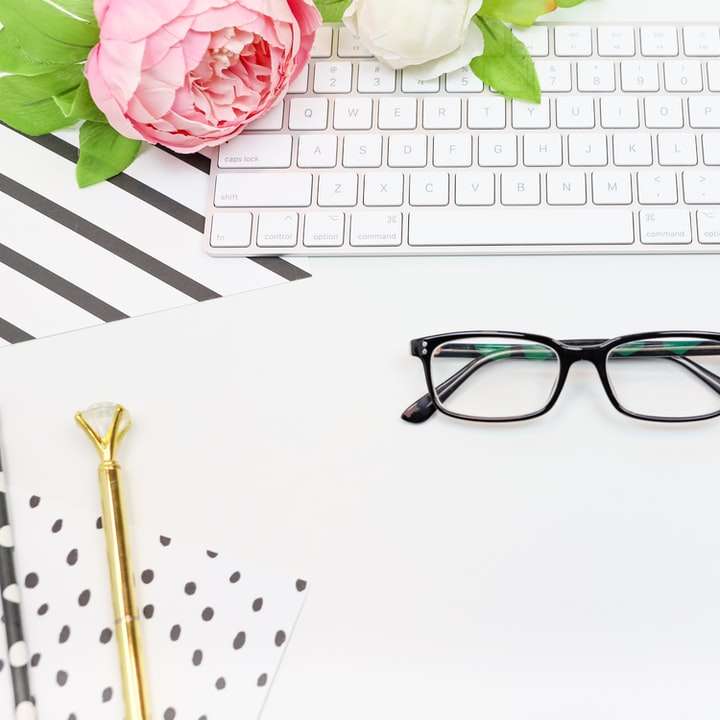 black framed eyeglasses on white paper sliding puzzle online