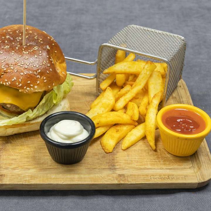 burger and fries on brown wooden chopping board sliding puzzle online
