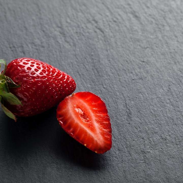 2 strawberries on white textile online puzzle