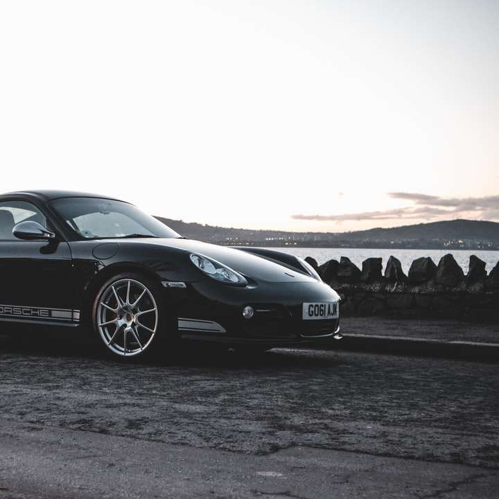 Schwarzer Porsche 911 auf Graustufenfotografie Schiebepuzzle online
