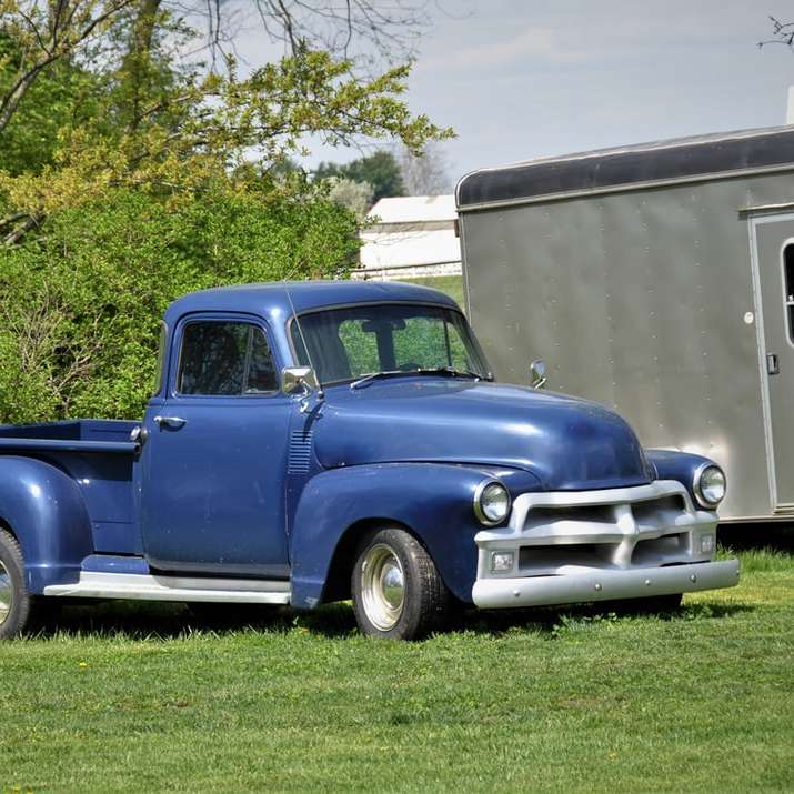 blue chevrolet single cab pickup truck parked sliding puzzle online