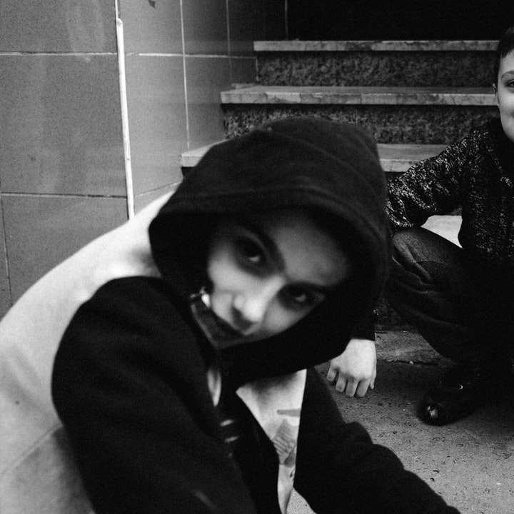 grayscale photo of 2 boys wearing hoodie sliding puzzle online
