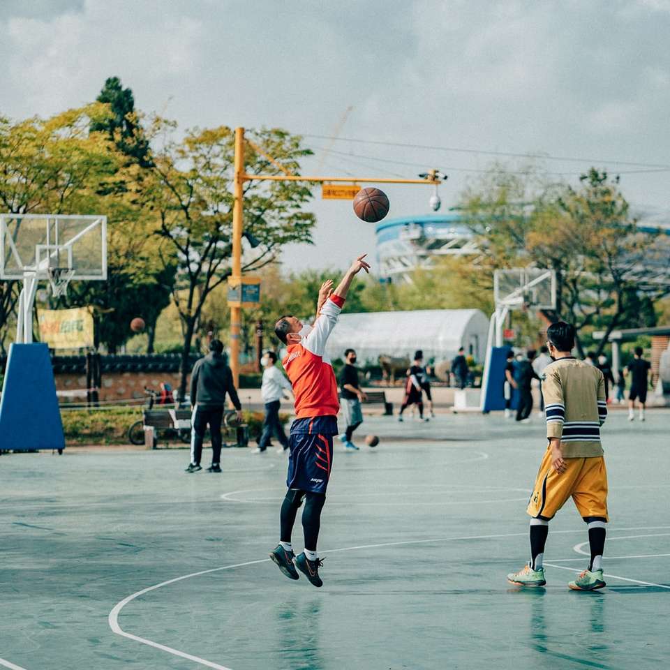 people playing basketball during daytime sliding puzzle online