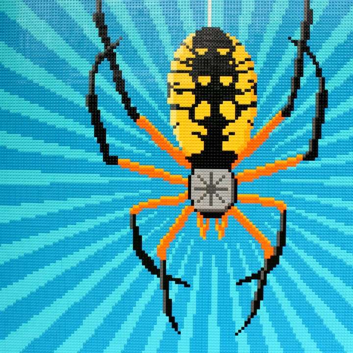 черно-желтый паук на бело-синей полосатой ткани онлайн-пазл