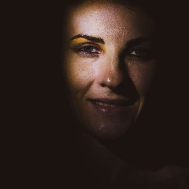 womans face with black background online puzzle