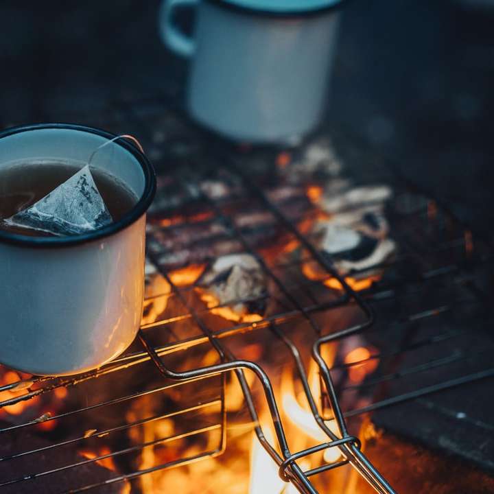 white ceramic mug on brown metal grill online puzzle