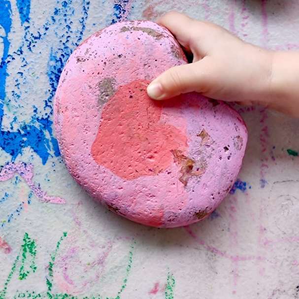 person holding pink and blue paint online puzzle