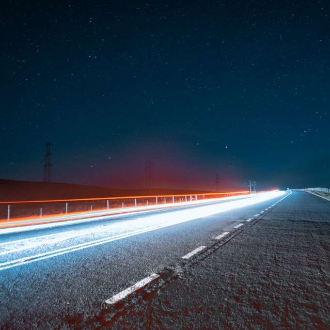 time lapse photography of road during night time online puzzle