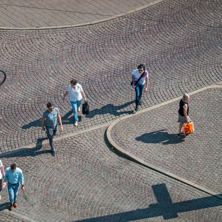 people walking on the street during daytime sliding puzzle online