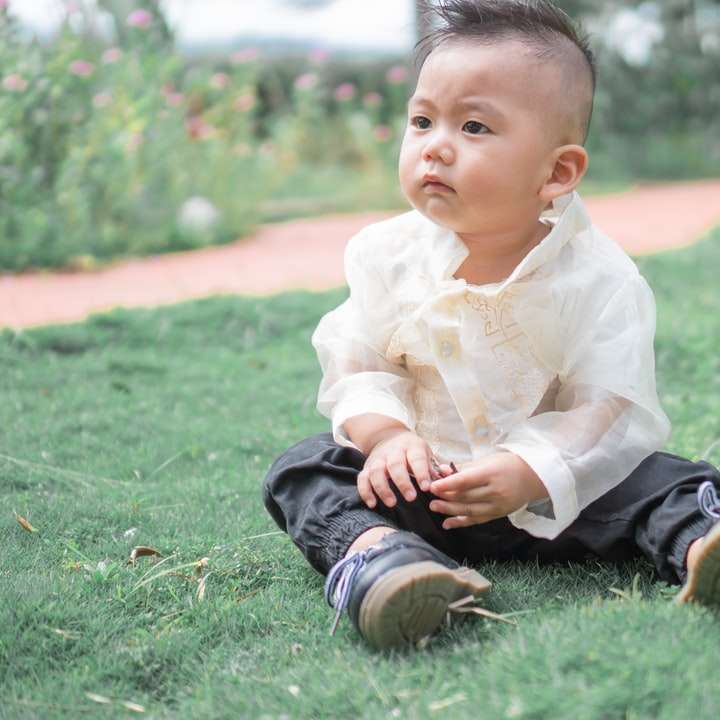 baby in white dress shirt and black pants online puzzle