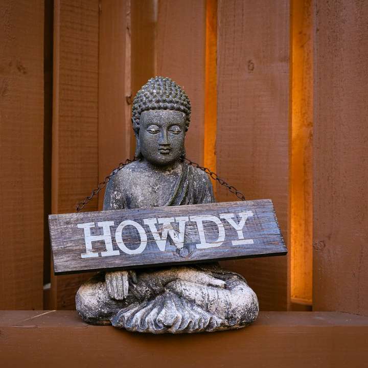 figurina di buddha in cemento grigio e bianco puzzle scorrevole online