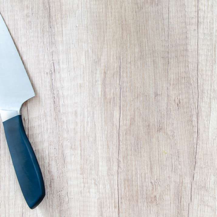 kitchen knife and green leaf vegetable on tableto sliding puzzle online
