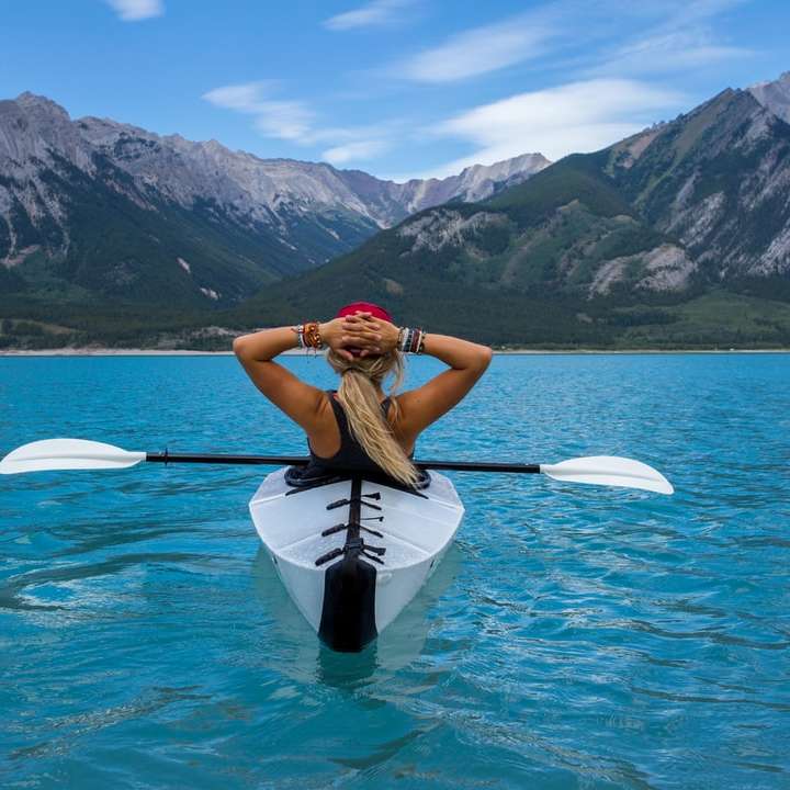 woman riding kayak at the middle of the sea online puzzle