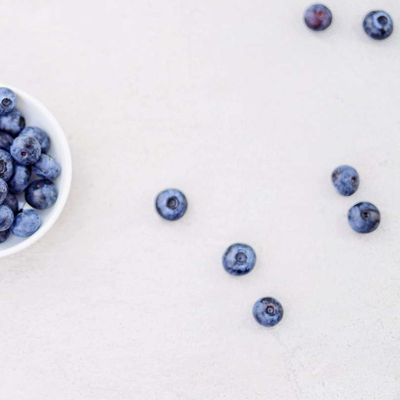 blueberries in bowl and white surface online puzzle