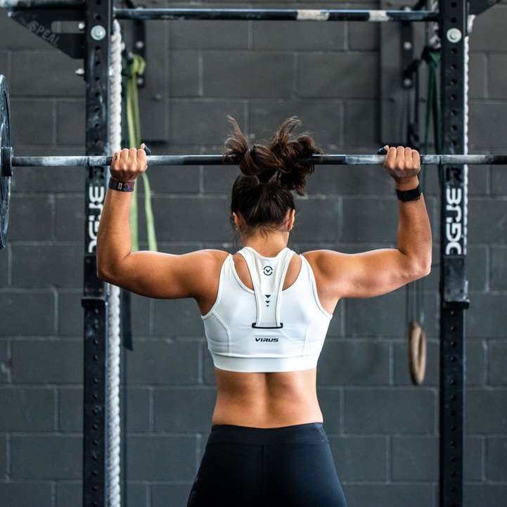 woman doing weight lifting sliding puzzle online