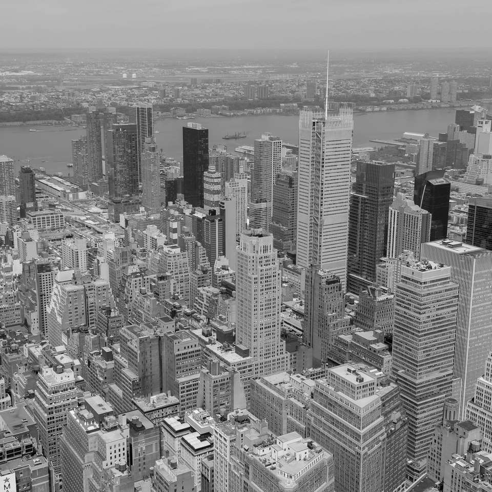 grayscale photo of city buildings sliding puzzle online