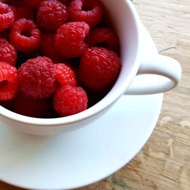 raspberries on white ceramic mug with saucer online puzzle