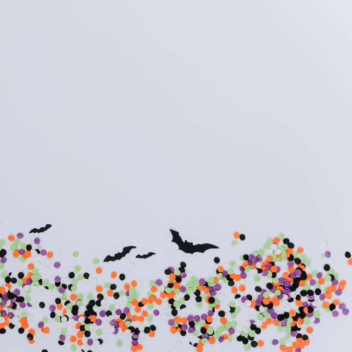 zwarte vleermuis en veelkleurige stippen illustratie schuifpuzzel online