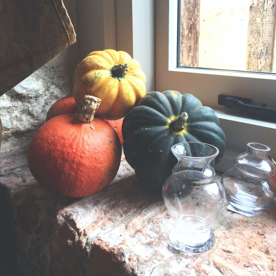 orange pumpkin beside clear glass jar sliding puzzle online