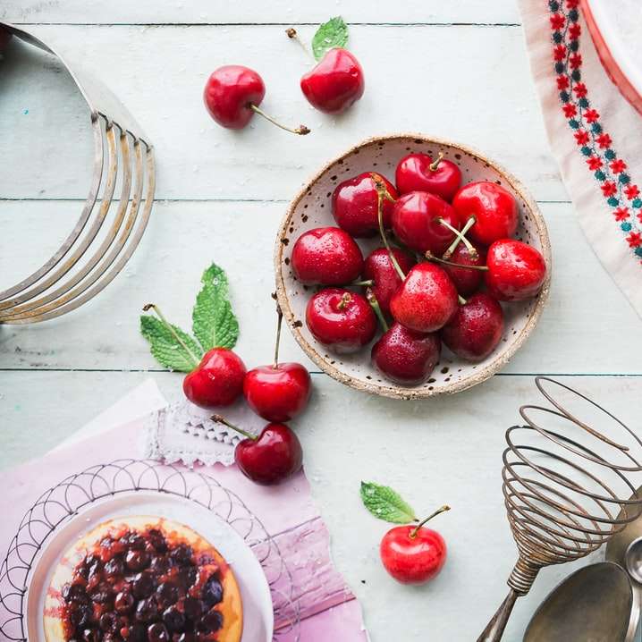 red berries in bowl on table online puzzle