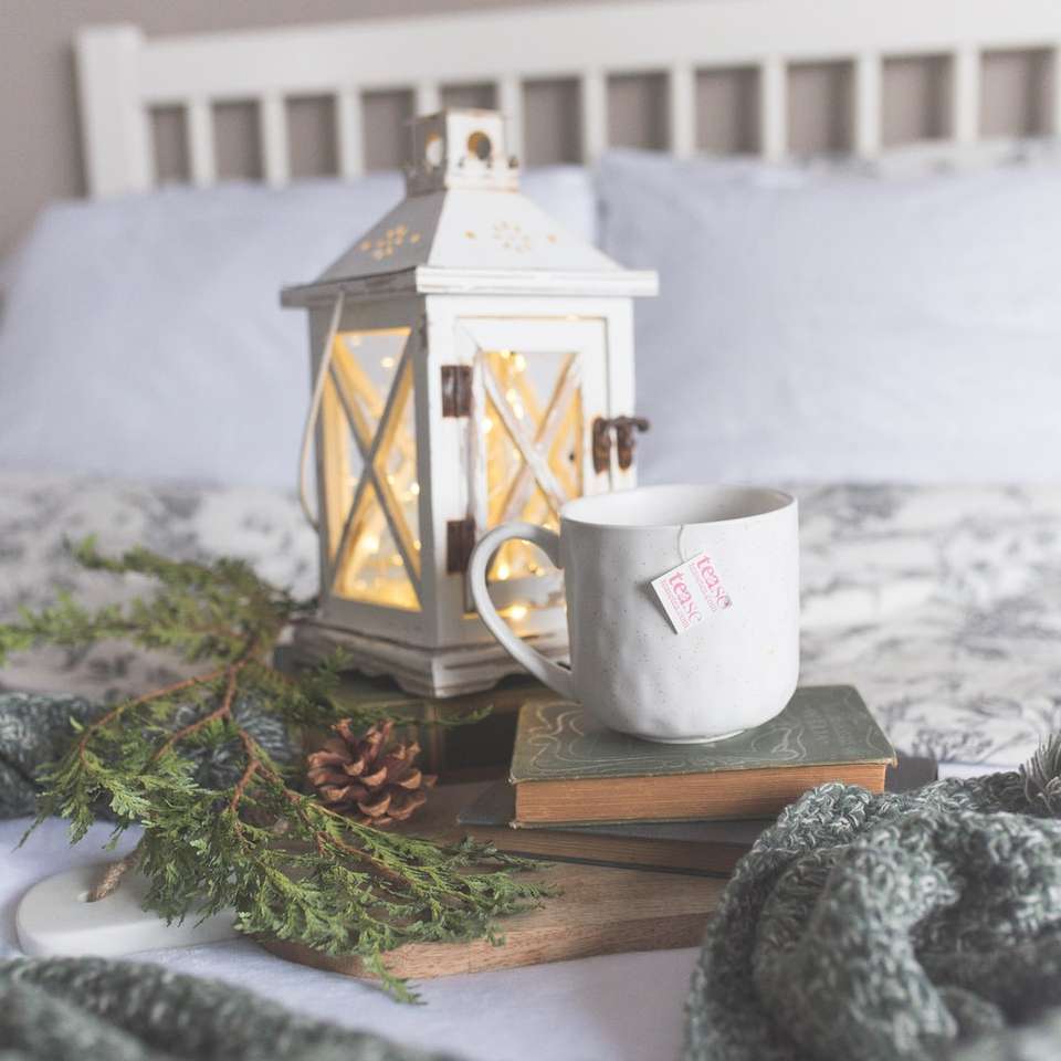 white ceramic mug and wooden candle holder online puzzle