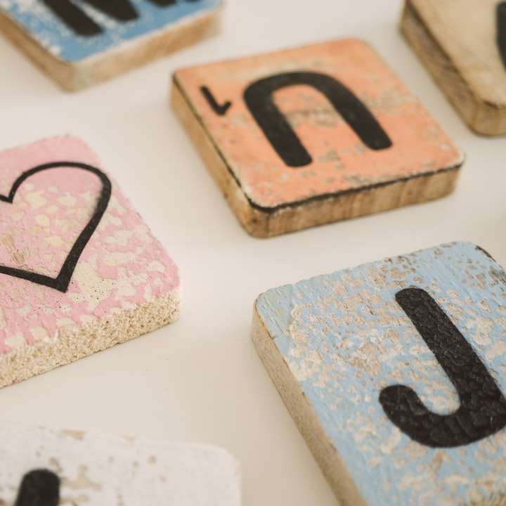 scrabble blocks and heart block on white surface online puzzle